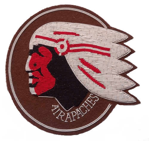 Dark brown oval patch with embroidered Native Apache Indian head looking to right. Words at bottom 'Air Apaches'