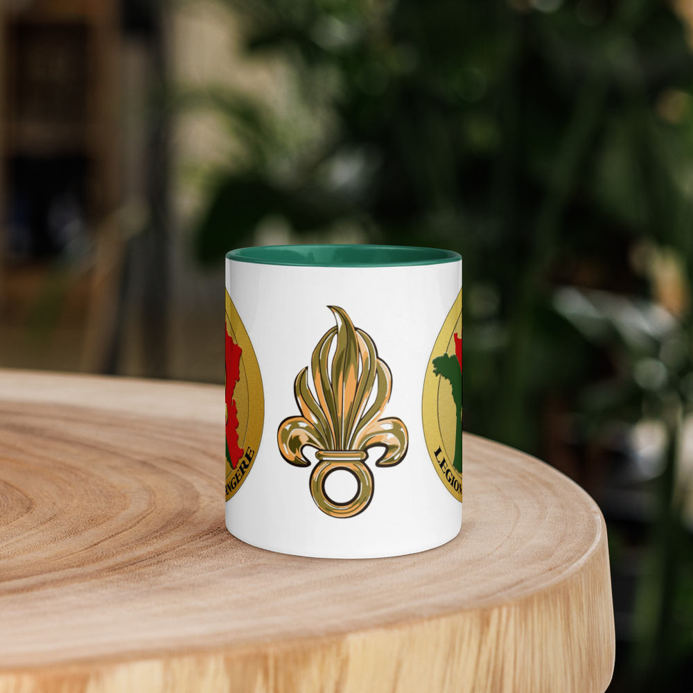 white ceramic coffee mug on a piece of wood with french foreign legion  insignia