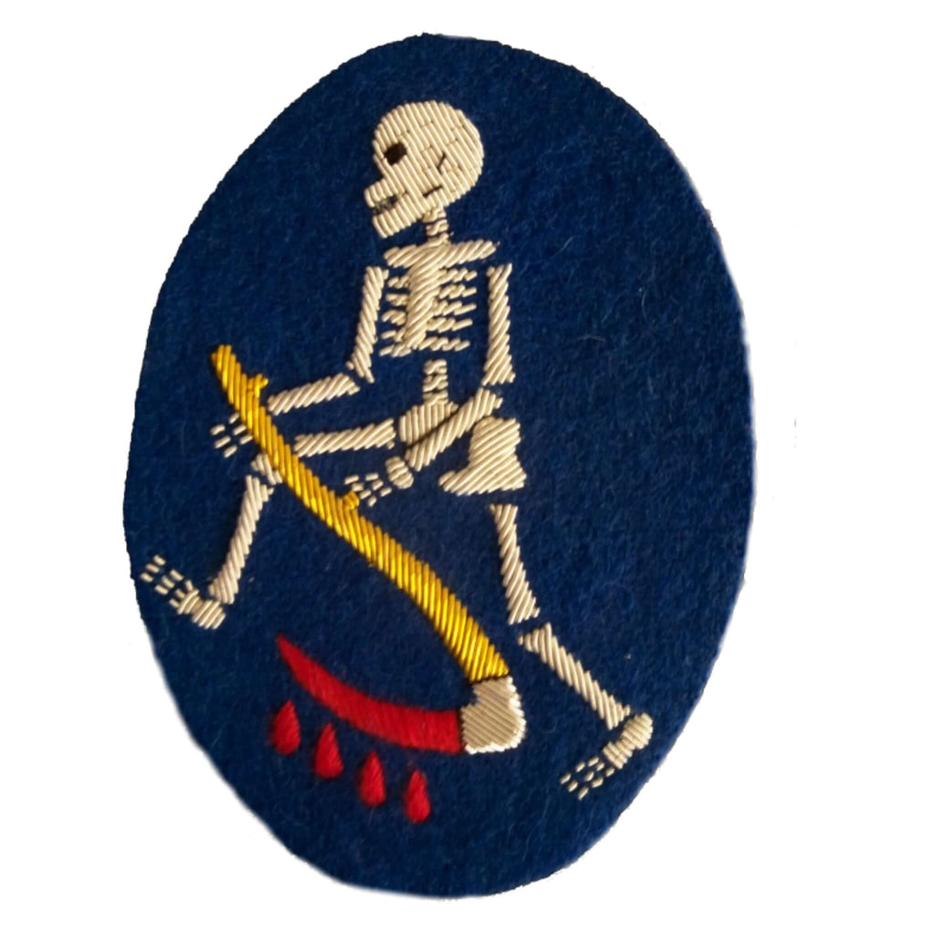 Silver skeleton holding a scythe on a blue oval shaped background