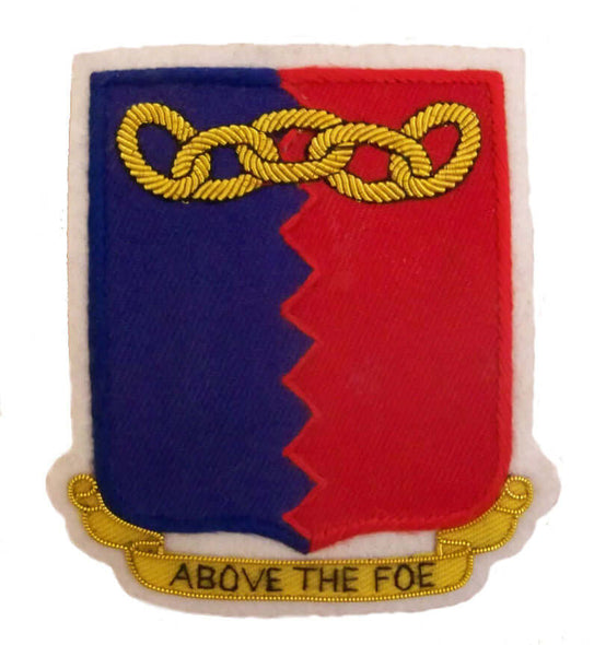Red and Blue rectangle shaped patch with gold chain along top edge. Bottom ribbon has words 'Above the Foe'