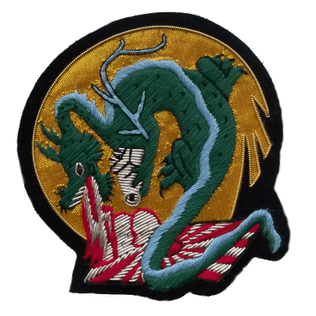 Gold background circle shaped patch with green dragon in center