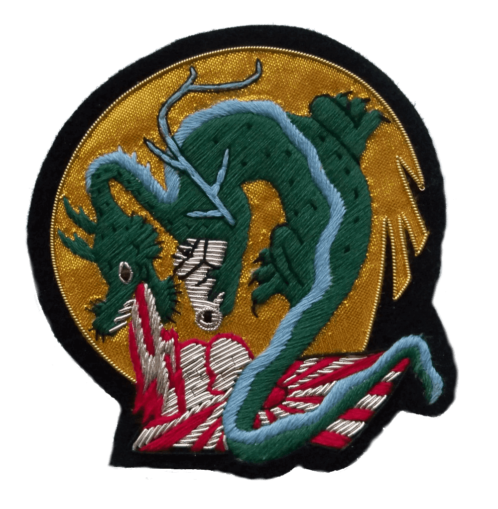 Gold background circle shaped patch with green dragon in center