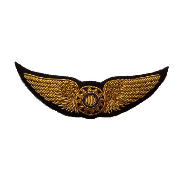 Gold embroidered wings with sun in center and blue inner circle.