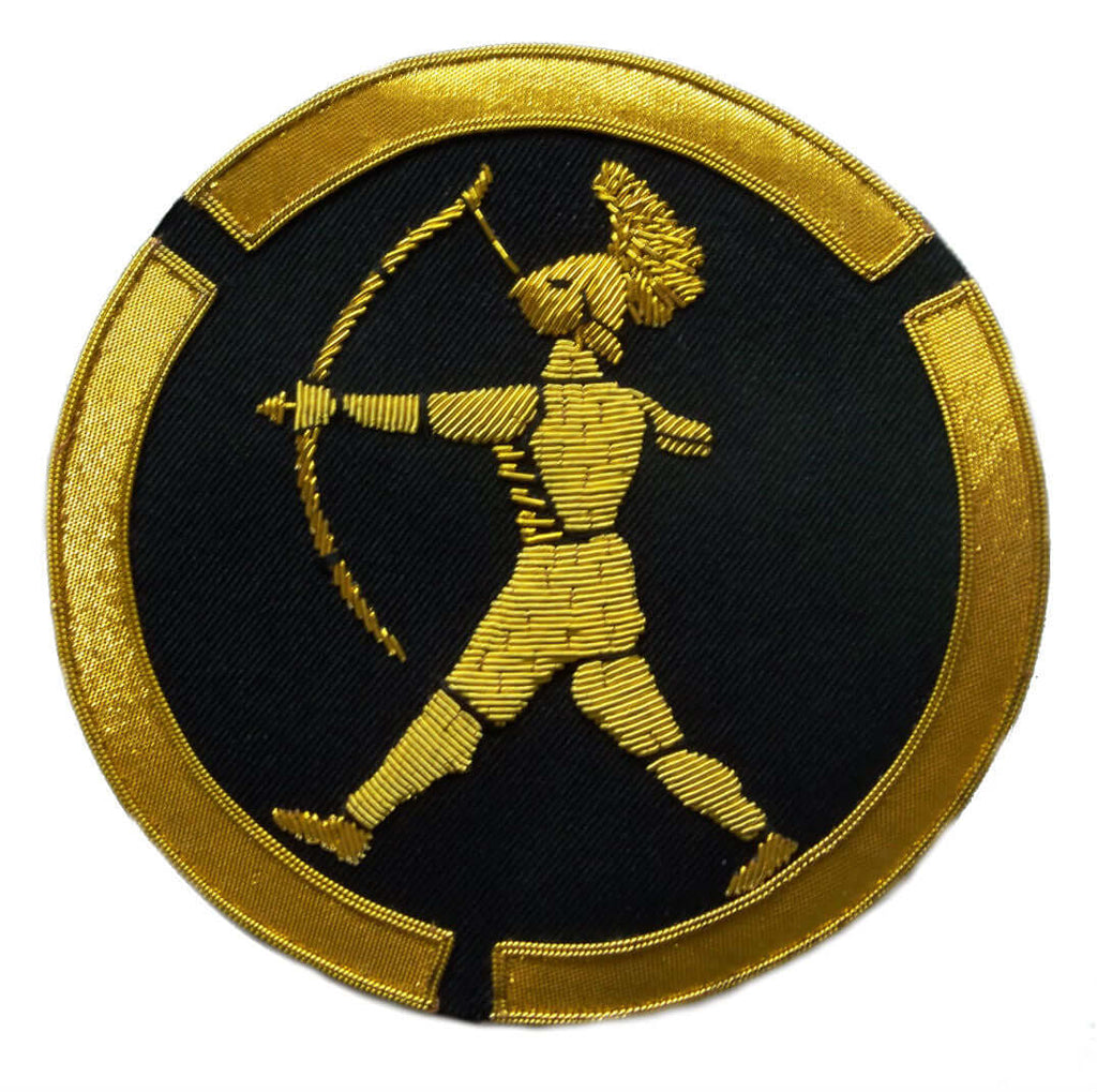 Gold gladiator holding bow and arrow in shooting position on black circle shaped patch with gold outer edge